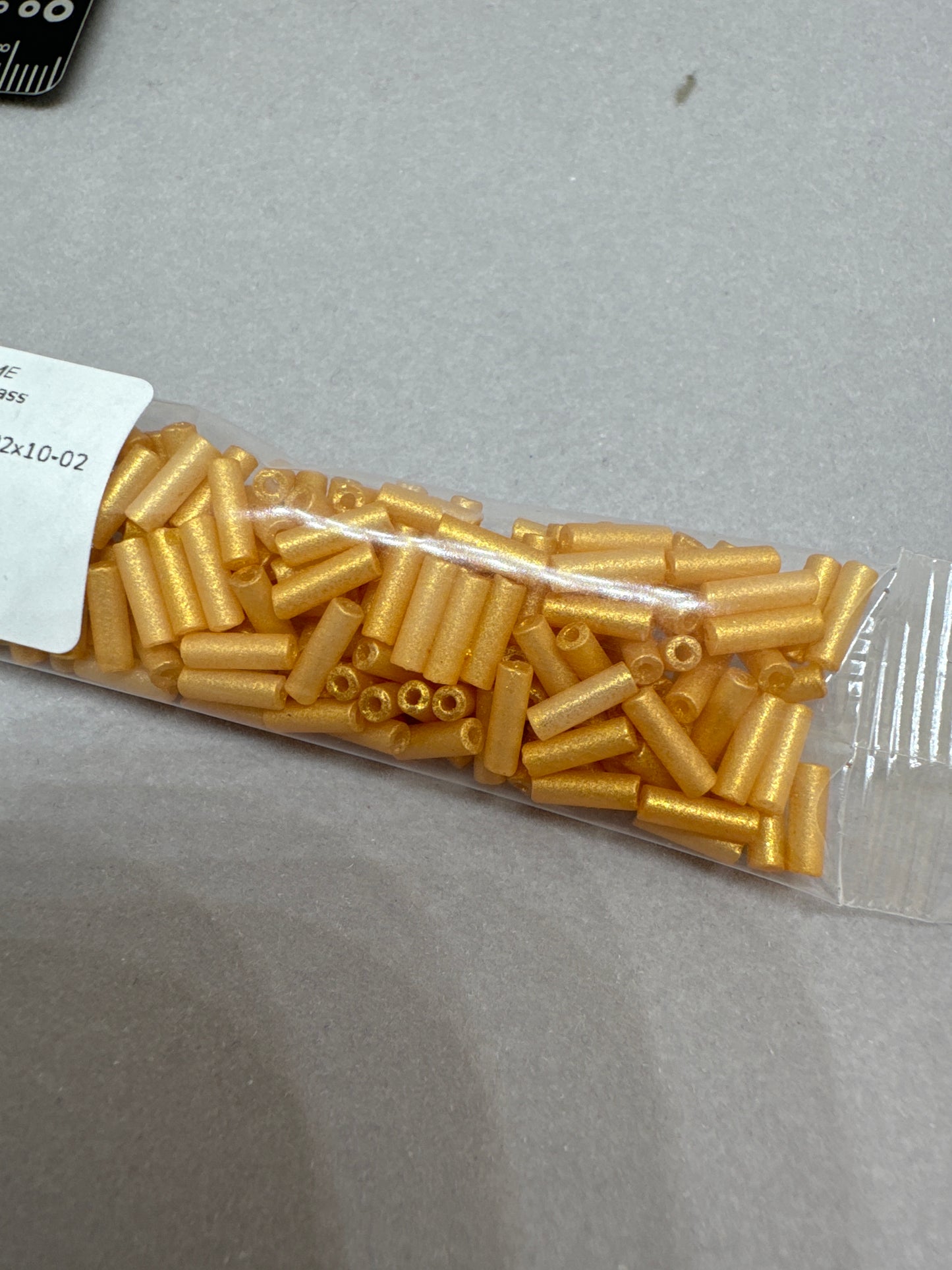 OUTLET 10 grams Bugles Beads, 2 x 10 mm, White Gold (02010-gold), Glass, Czech Republic