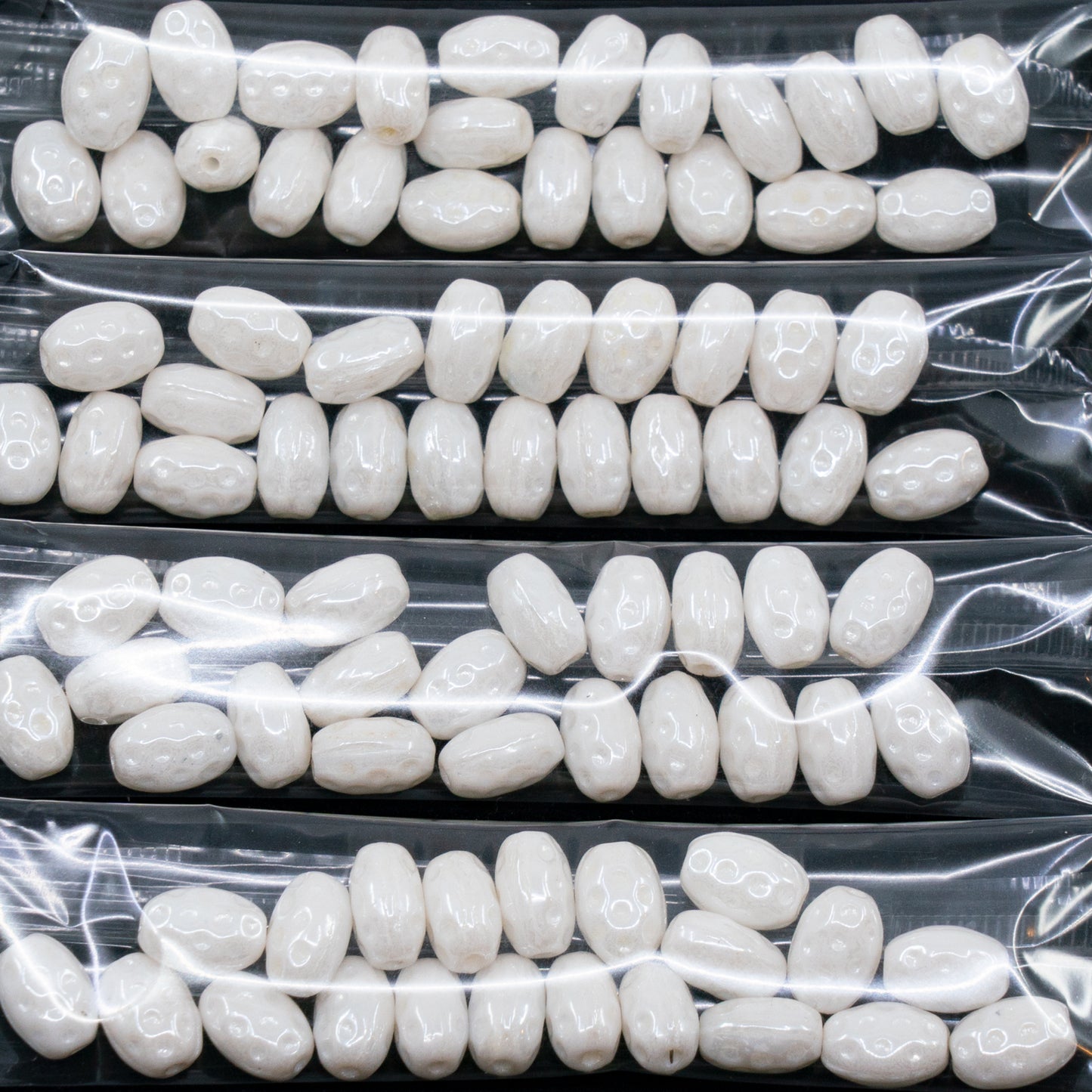 OUTLET 10 grams Pressed Beads, 10 x 6 mm, Chalk White Hematite (03000-14400), Glass, Czech Republic
