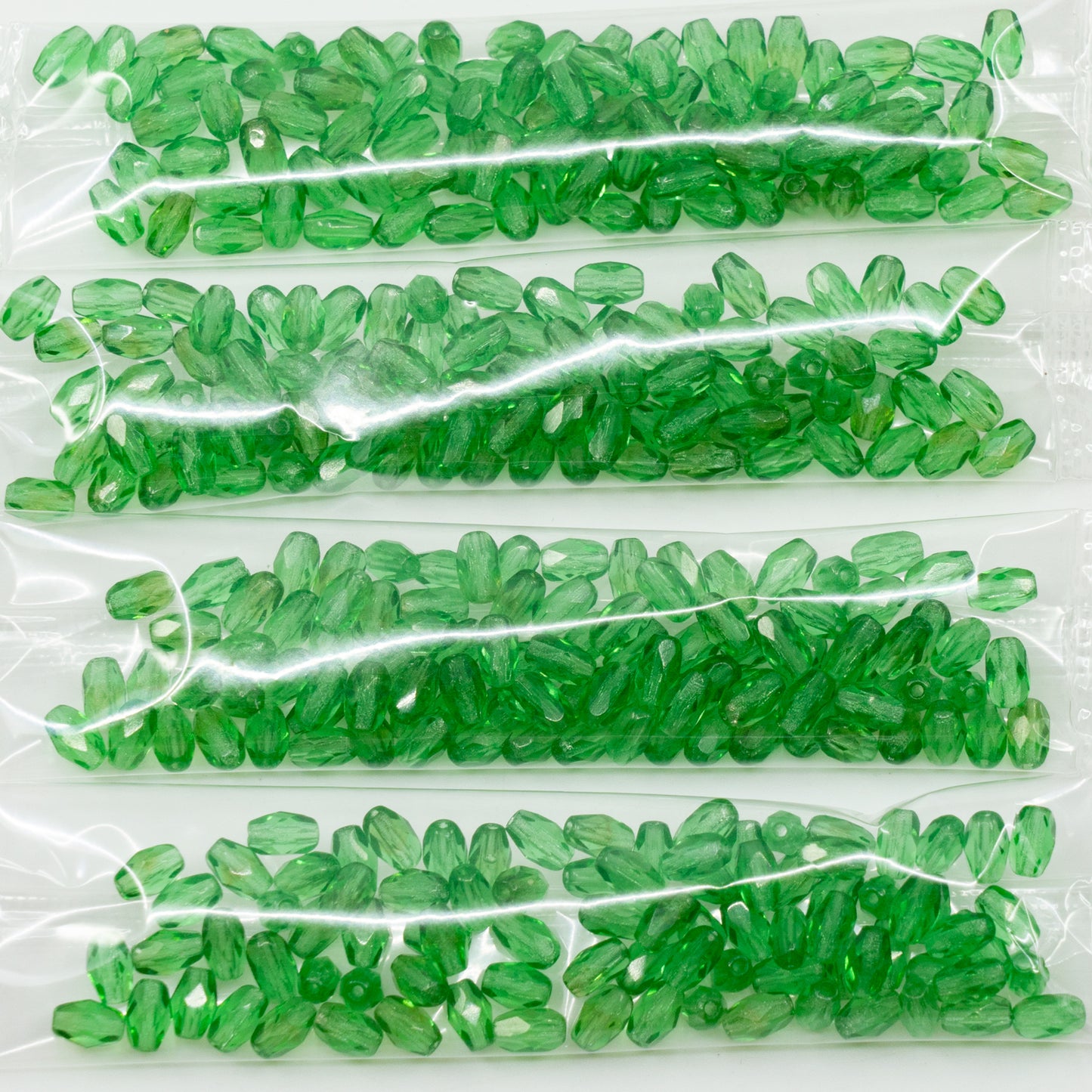OUTLET 10 grams Oval Faceted Beads, Transparent Green (50740), Glass, Czech Republic