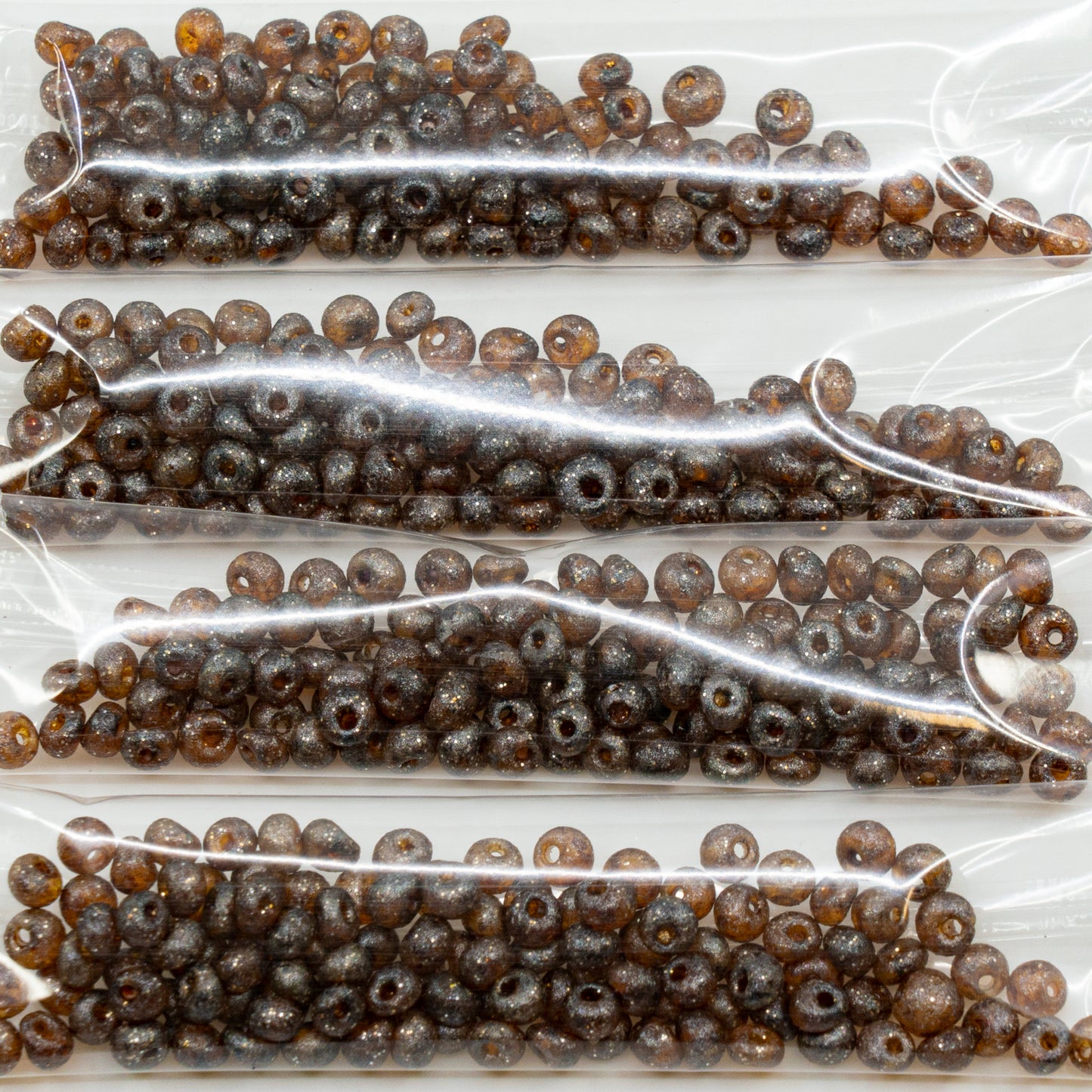 OUTLET 10 grams Preciosa Ornela Drops Seed Beads, Round Hole, Loose, 5/0-1 x mm, Transparent Light Topaz Yellow Travertin Glitter (10020-86800-glitter), Glass, Czech Republic