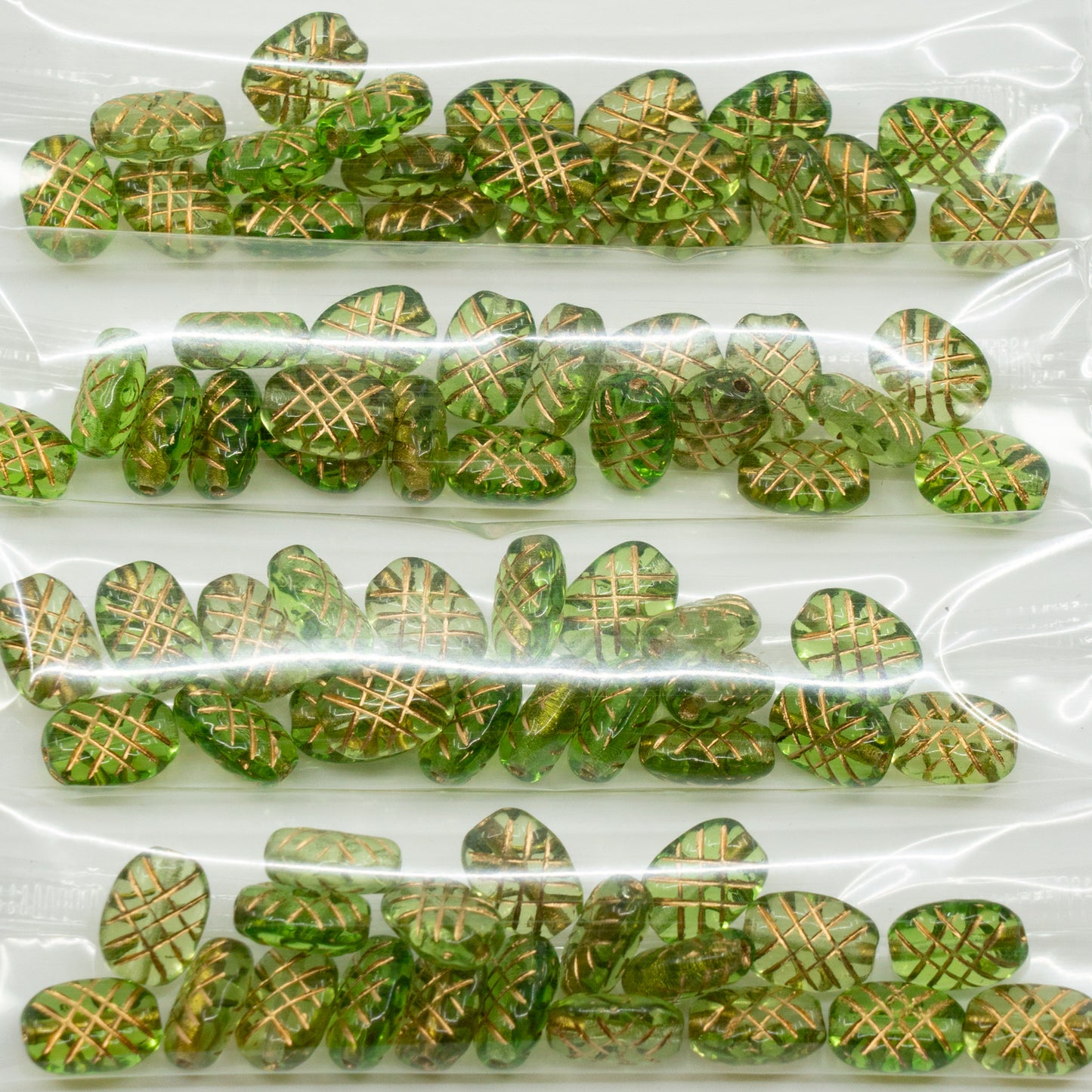 OUTLET 10 克椭圆形交叉线条珠子,10 x 7 毫米,透明绿色金线 (50410-54202),玻璃,捷克共和国