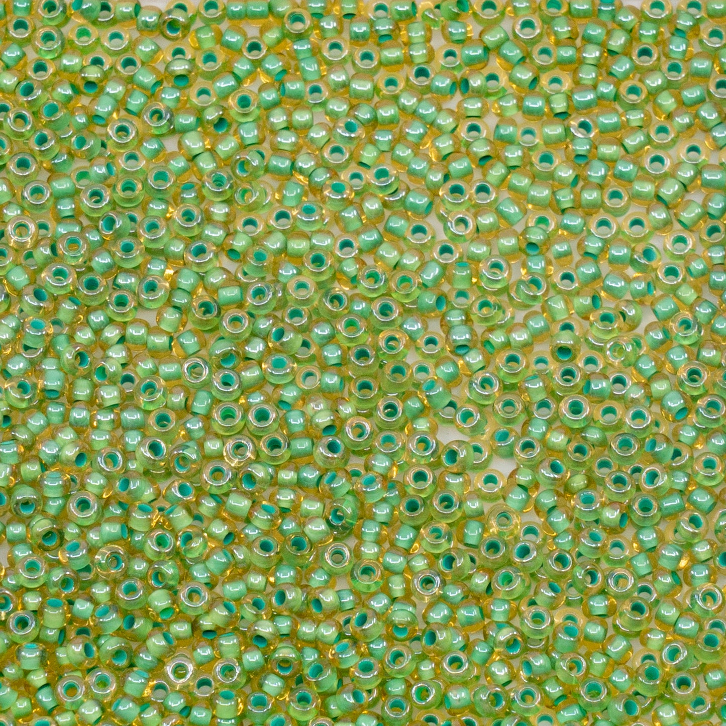 OUTLET 10 grams Preciosa Ornela Seed Beads, Round Hole, Loose, 10/0, lt. topaz, colour lined green, sfinx (11355), Glass, Czech Republic