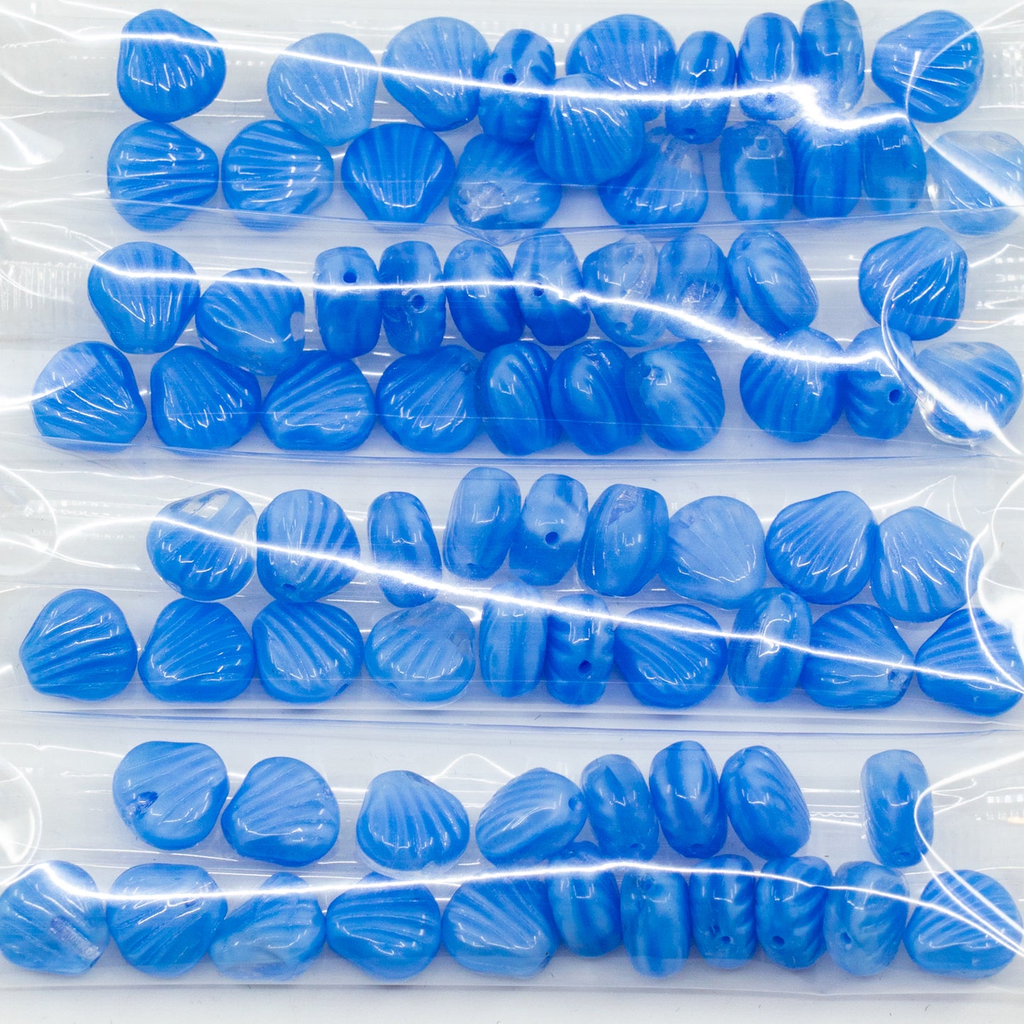 OUTLET 10 grams Small Seashell Beads, 9 x 09- mm, Ilk Blue (ilk-blue), Glass, Czech Republic