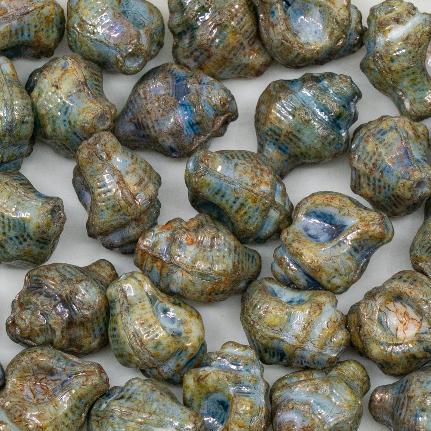 OUTLET 250g/50g Murex Shell Beads, 15 x 12 mm, White Stain With Luster Blue (02010-65431), Glass, Czechia