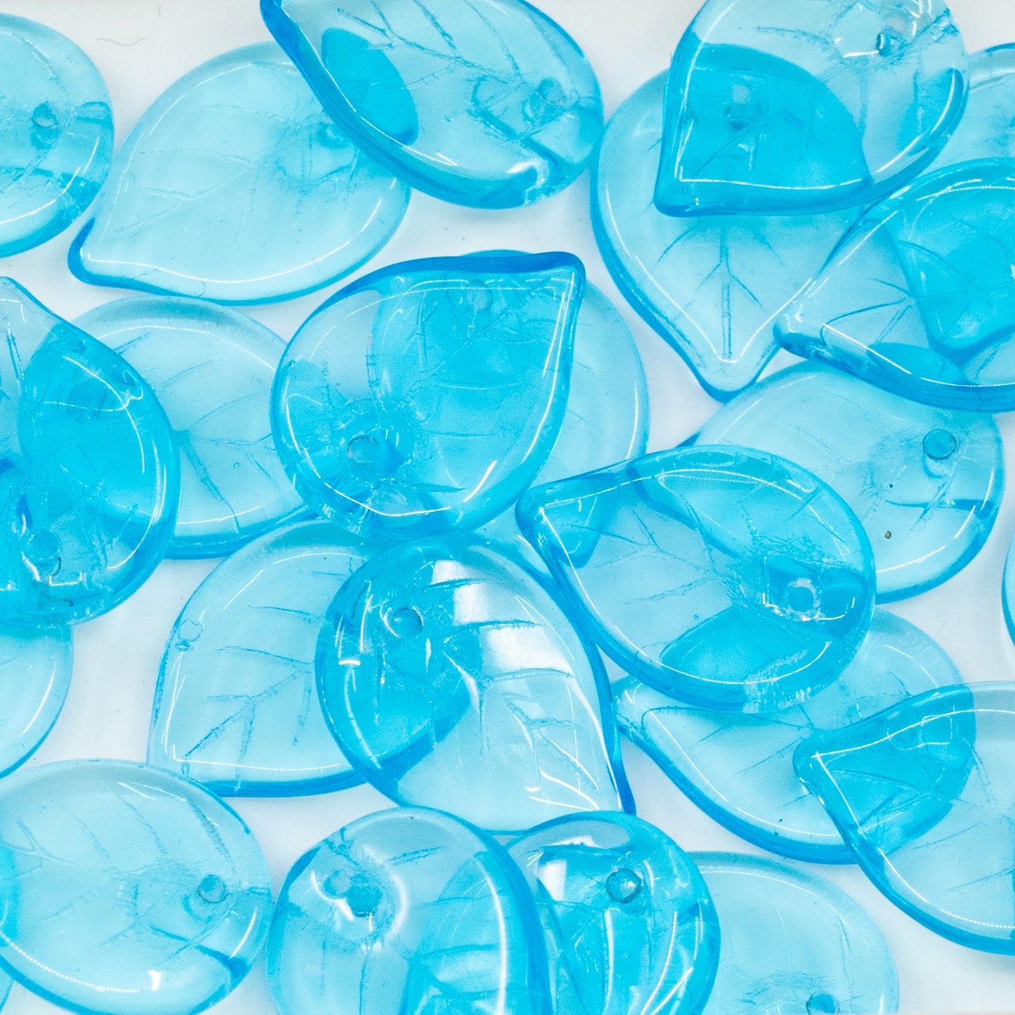 OUTLET 10 grams Apple Leaf Beads, 18 x 13 mm, Transparent Aqua (60010), Glass, Czech Republic