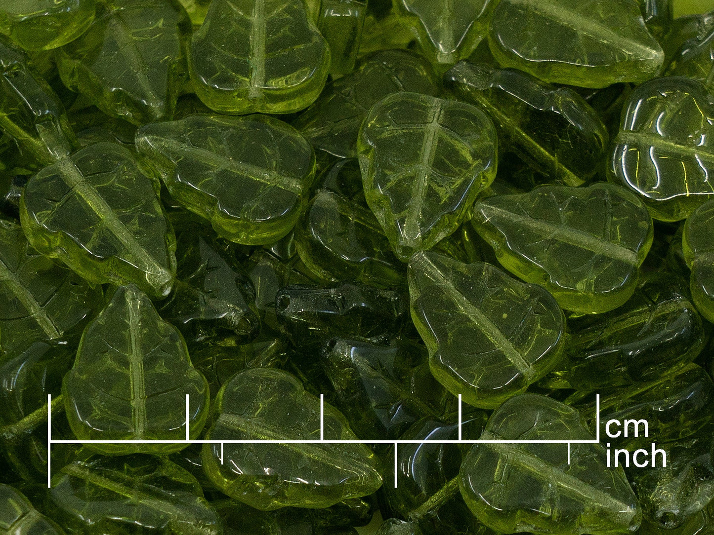OUTLET 10 grams Pressed Beads Leaves, 12 x 10 mm, Transparent Green (50230), Glass, Czech Republic
