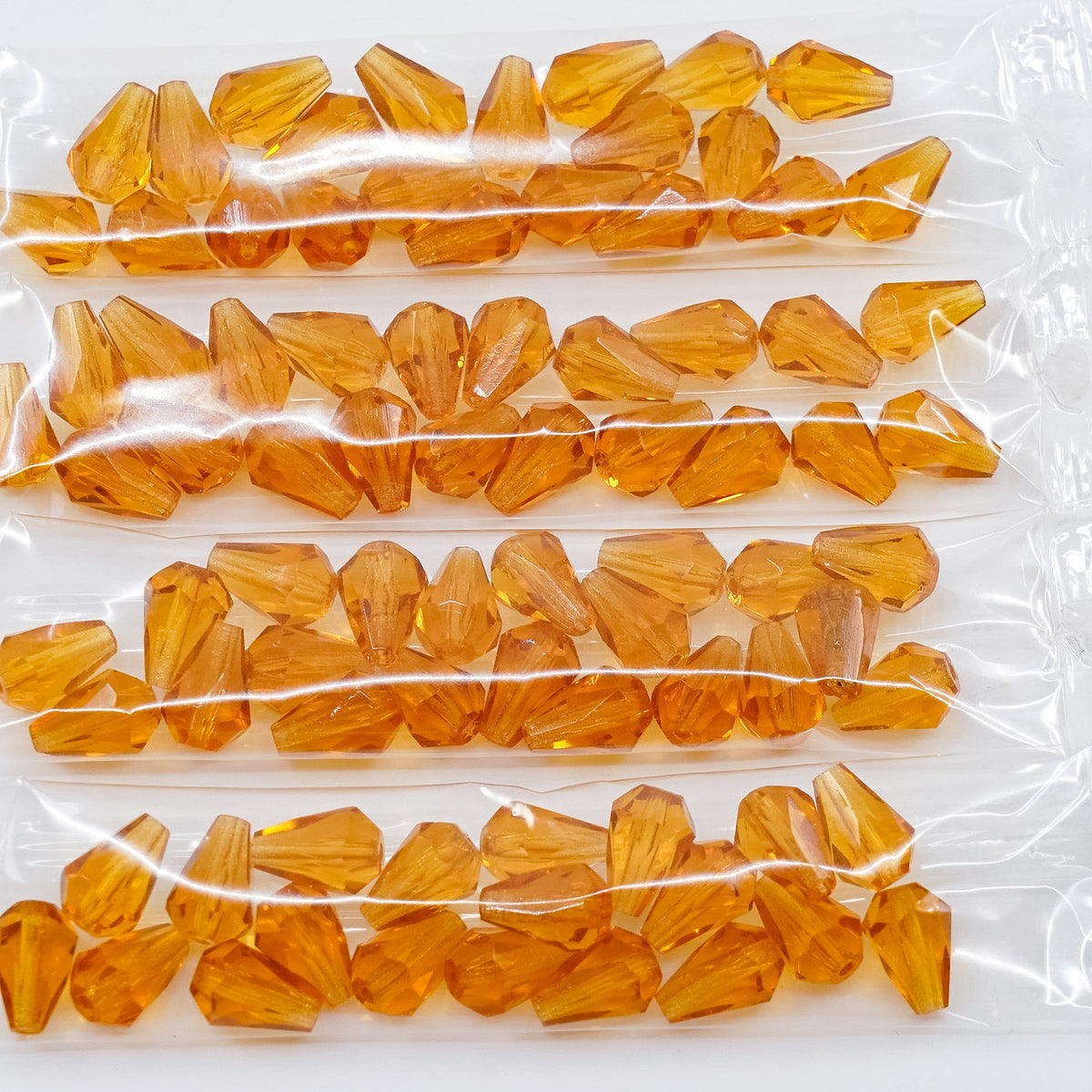 OUTLET 10 grams Pear Teardrop Beads Faceted Fire Polished, 10 x 7 mm, Transparent Orange (10050), Glass, Czech Republic