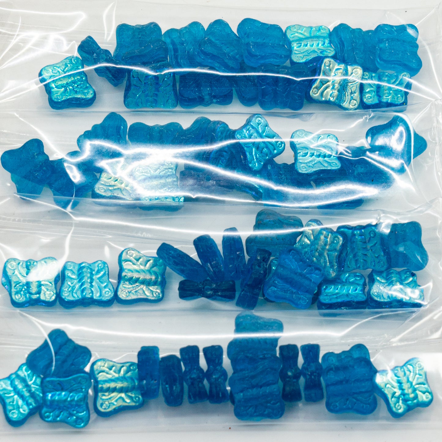 OUTLET 10 grams Pressed Beads Butterflies, 12 x 12 mm, 60060 Ab (60060-28701), Glass, Czech Republic