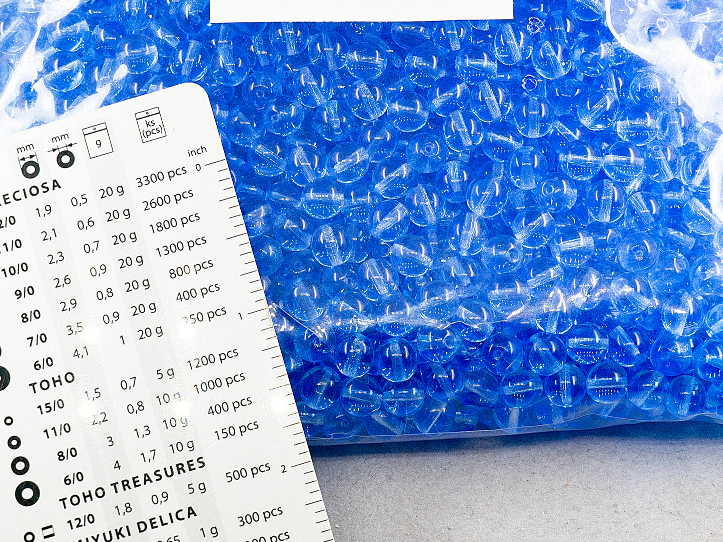 アウトレット 250g ラウンドプレスドドラックビーズ、7 x 7 mm、透明ブルー(30030)、ガラス、チェコ共和国