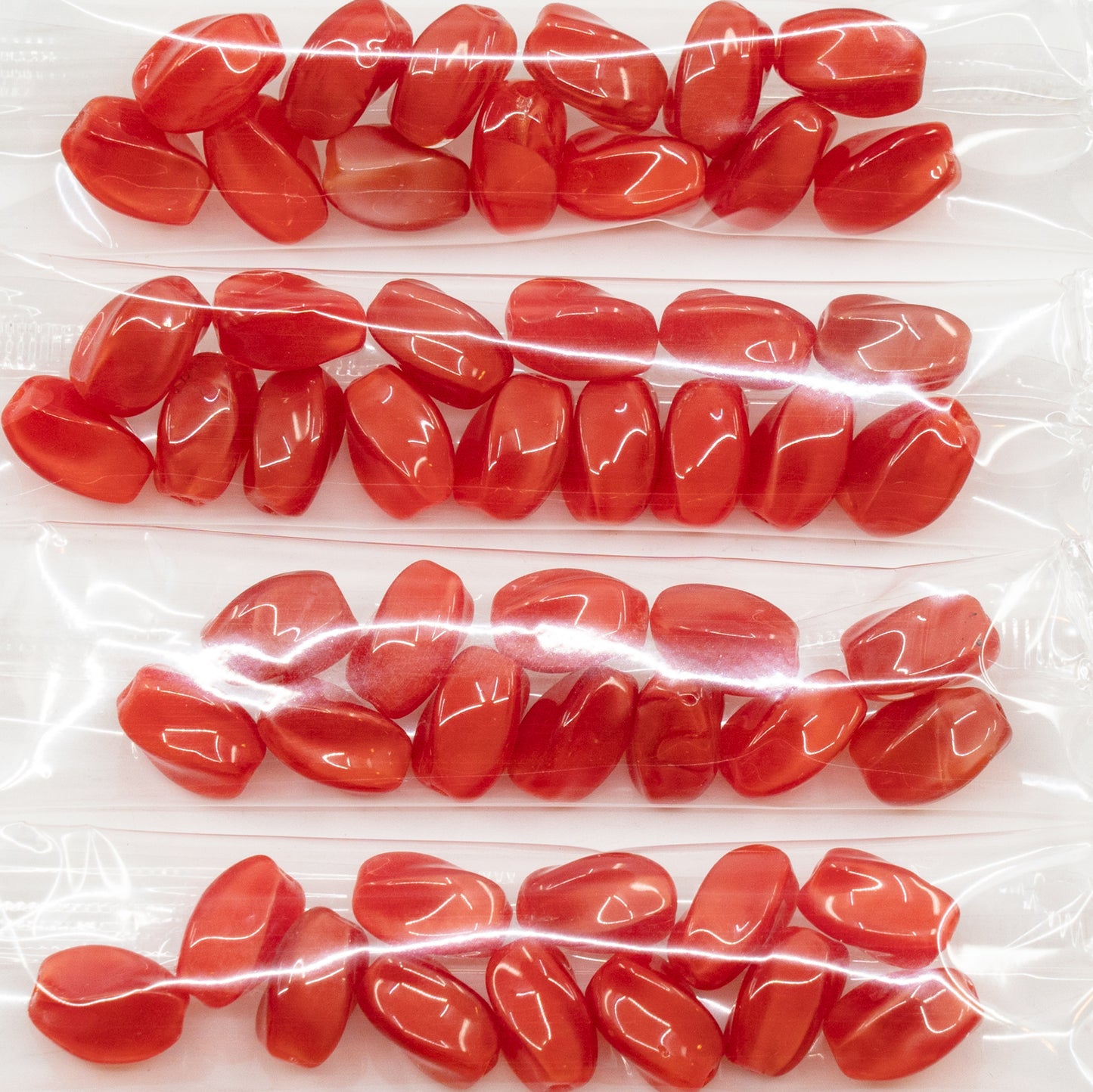 OUTLET 10 grams Twisted Oval Pressed Glass Beads, 9 x 7 mm, Red Silk (red-silk), Glass, Czech Republic