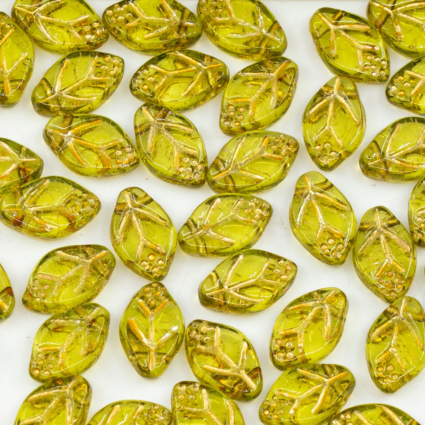 OUTLET 250 grams Pressed Beads, 7 x 12 mm, Transparent Green Gold Lined (50220-54302), Glass, Czech Republic