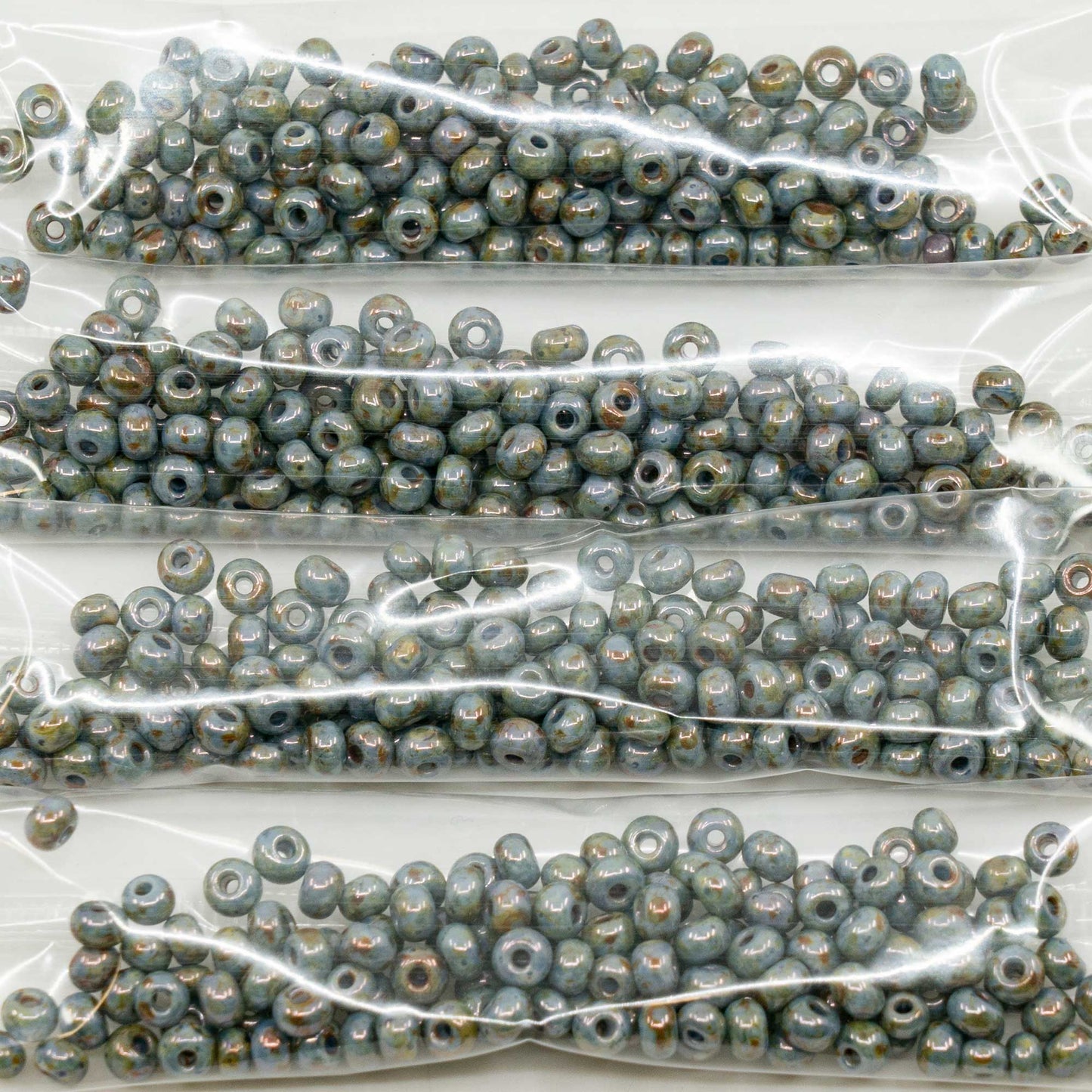 OUTLET 10 克 Preciosa Ornela 种子珠,圆孔,散装,6/0,蛋白石染色,蓝色光泽 (02090-65431),玻璃,捷克共和国