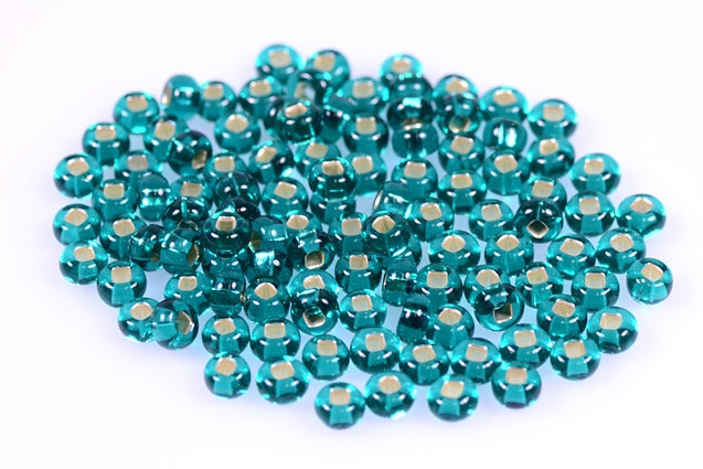 プレシオサ・オルネラ・ロカイユ ラウンドシードビーズ、透明ティールグリーン、シルバーライン（57710）、ガラス、チェコ共和国