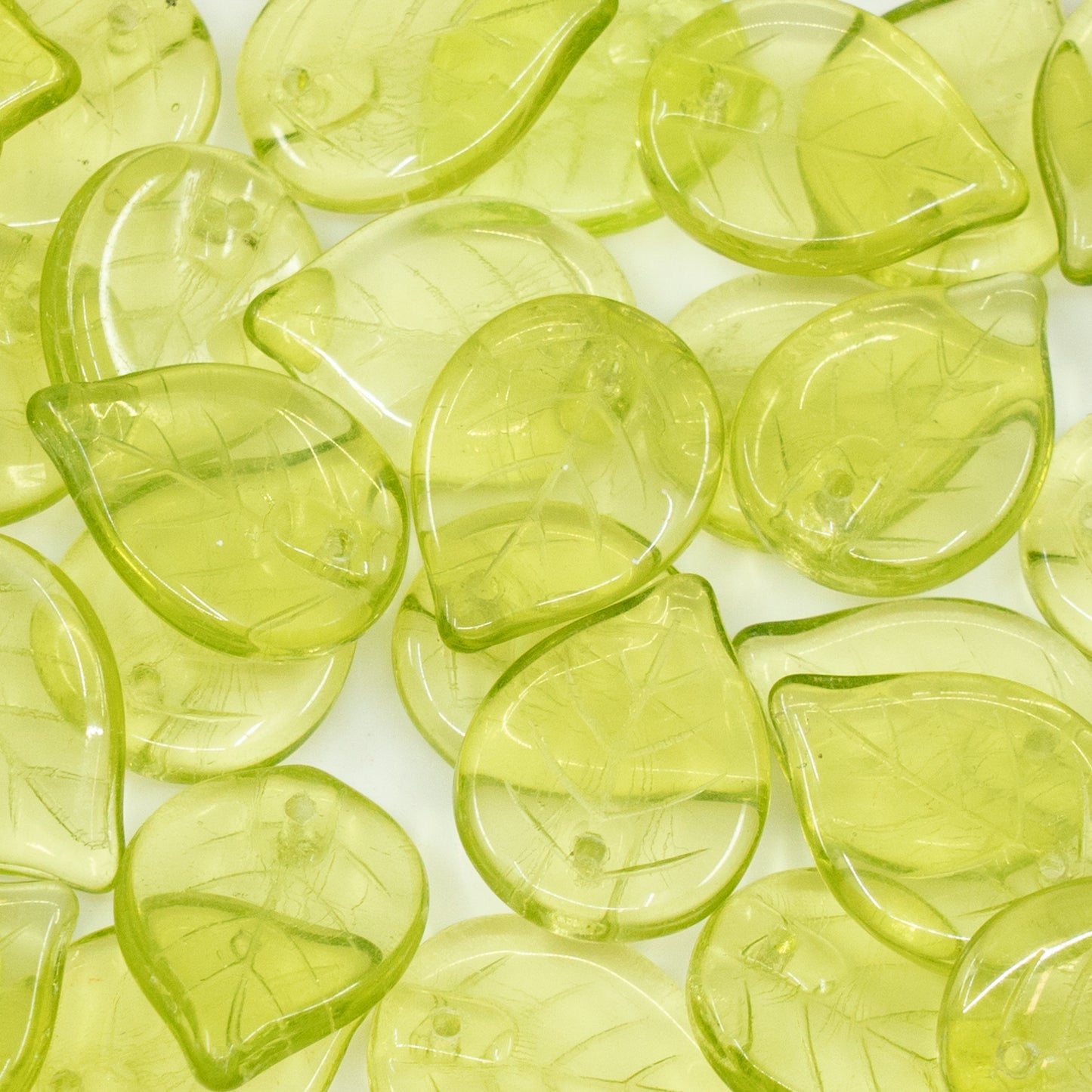 OUTLET 10 grams Apple Leaf Beads, 18 x 13 mm, Transparent Green (50220), Glass, Czech Republic