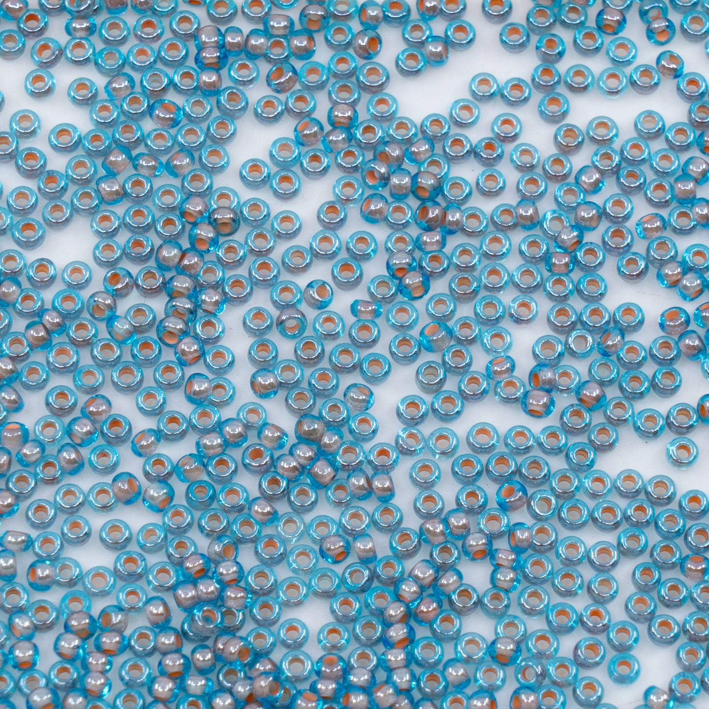 OUTLET 10 grams Preciosa Ornela Seed Beads, Round Hole, Loose, 10/0, aquamarine, colour lined brown, sfinx (61017), Glass, Czech Republic