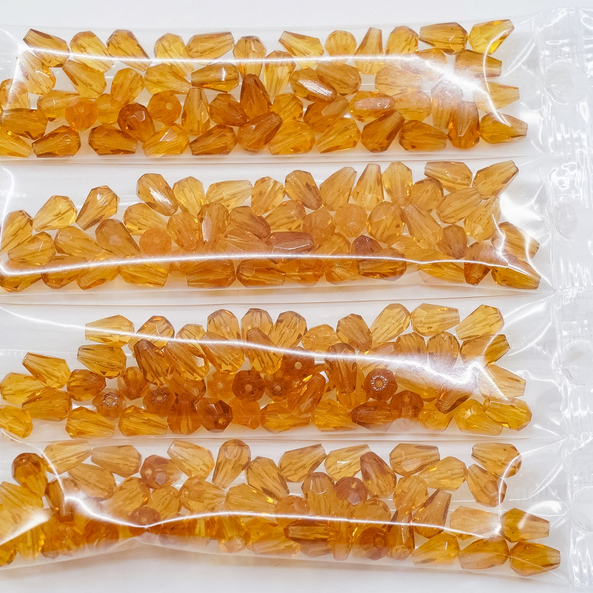 OUTLET 10 grams Pear Teardrop Beads Faceted Fire Polished, 7 x 5 mm, Transparent Orange (10050), Glass, Czech Republic