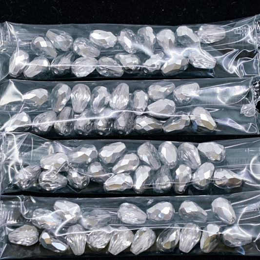 OUTLET 10 grams Pear Teardrop Beads Faceted Fire Polished, 10 x 7 mm, Crystal Crystal Silver Half Coating (00030-27001), Glass, Czech Republic