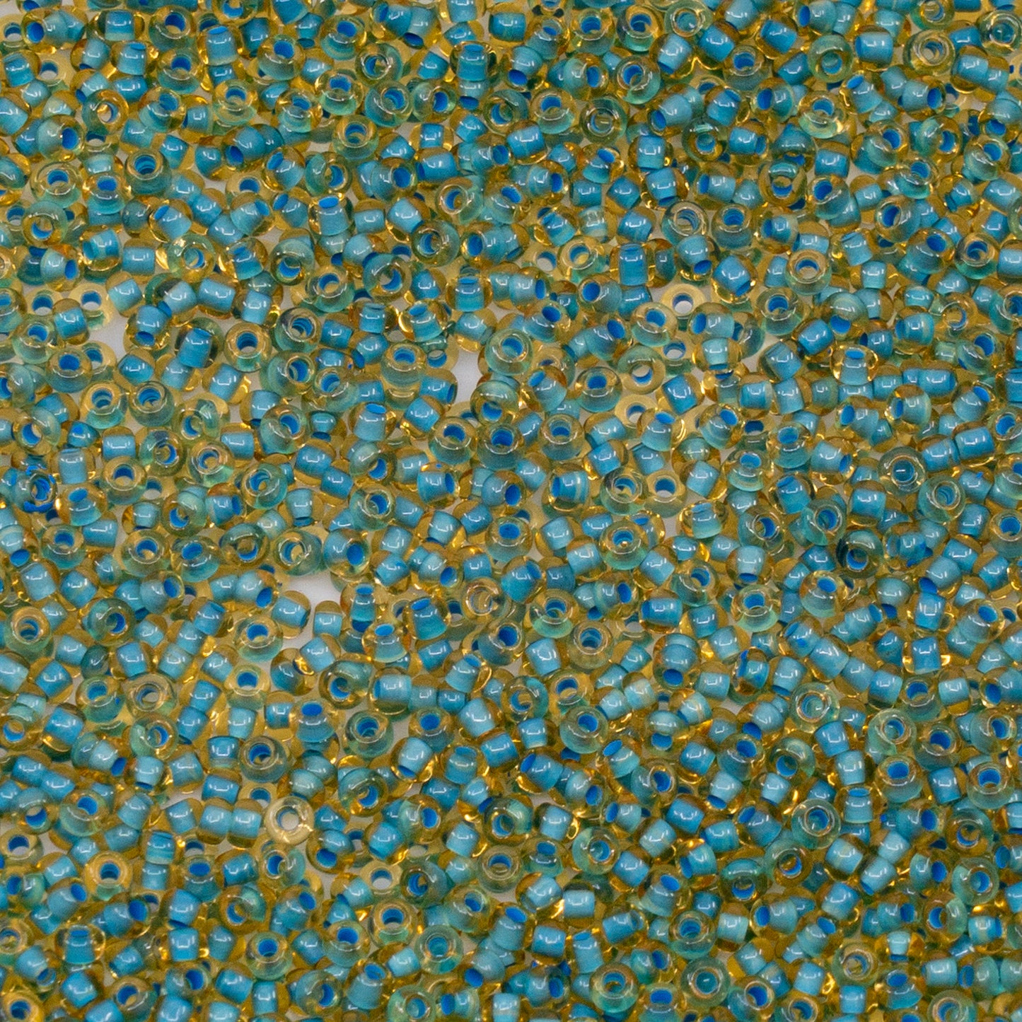 OUTLET 10 grams Preciosa Ornela Seed Beads, Round Hole, Loose, 10/0, lt. topaz, colour lined blue, sfinx (11337), Glass, Czech Republic