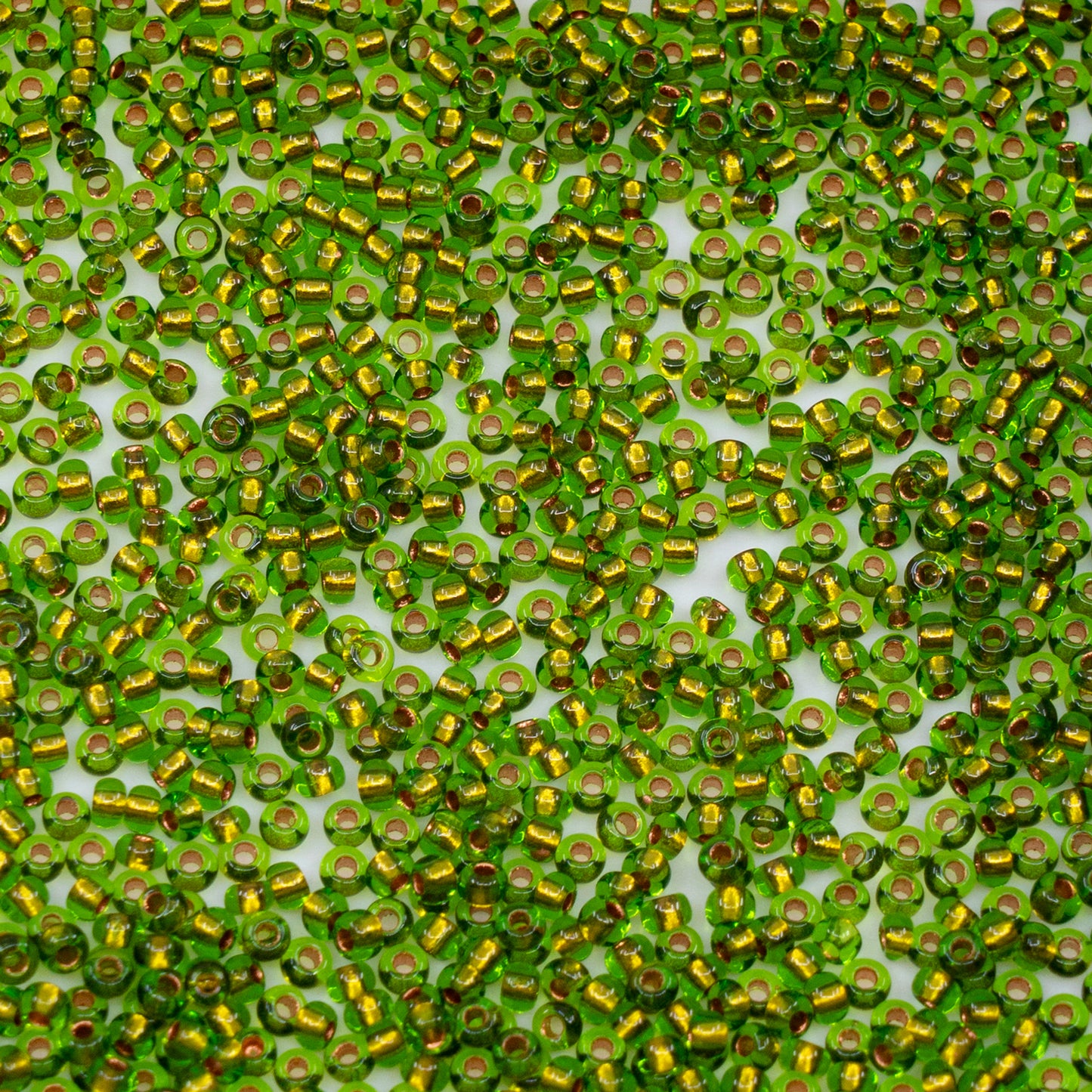 OUTLET 10 grams Preciosa Ornela Seed Beads, Round Hole, Loose, 10/0, transp. green, copper lined (59430), Glass, Czech Republic